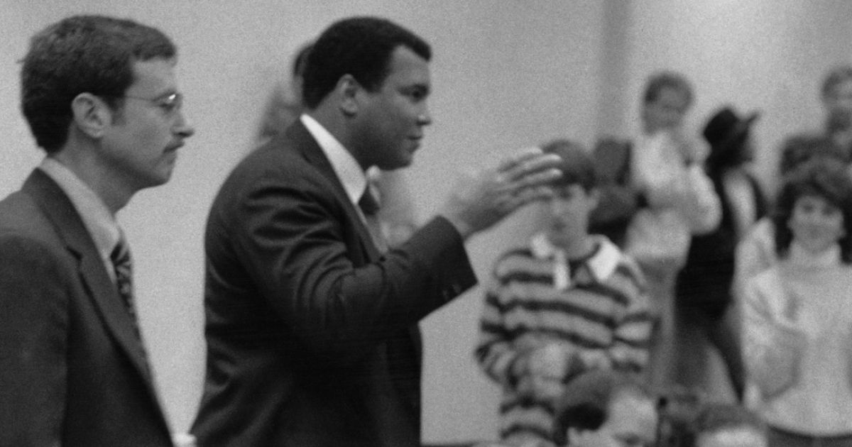 Boxing legend Muhammad Ali visits then-Professor Stephen A. Saltzburg’s Criminal Procedure class in 1988 to discuss U.S. v. Clay. The Supreme Court case centered on Ali, formerly known as Cassius Clay, and his failure to report for military service during the Vietnam War on conscientious objector grounds. 