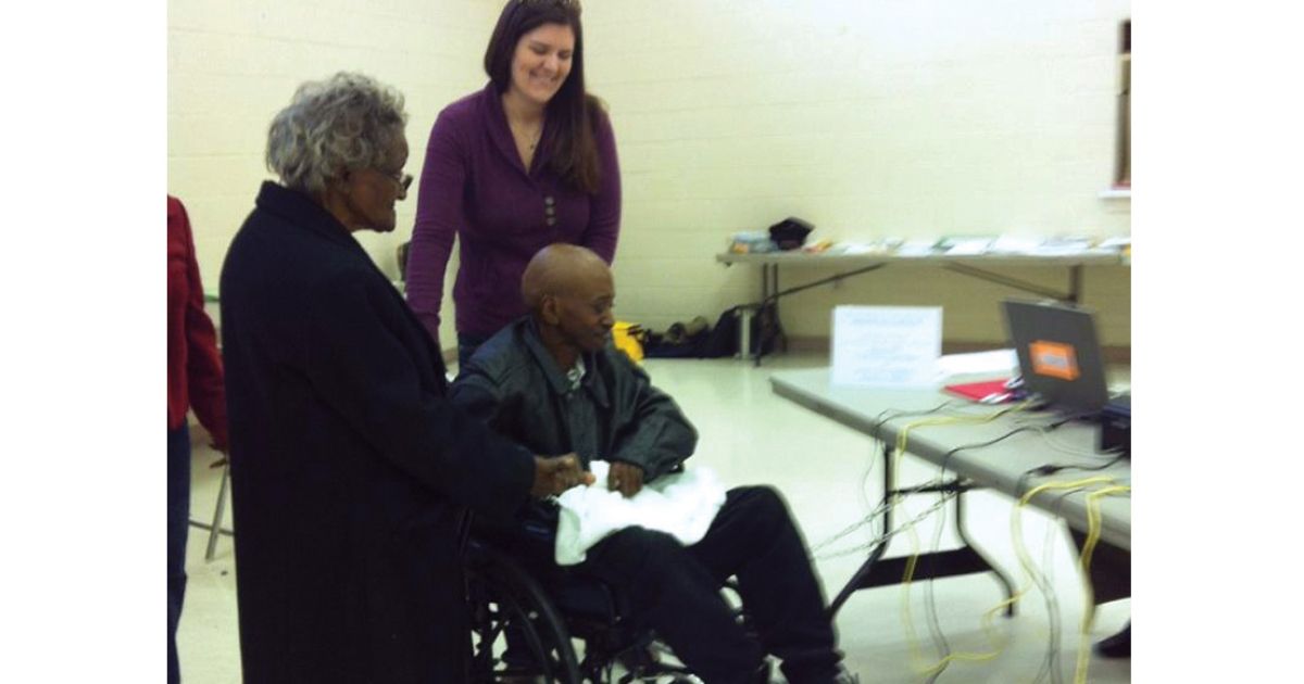 Innocence Project Clinic student Alexandra Meador ’14 accompanies client Bennett Barbour to the polls in November 2012 as he votes for the first time, after he was exonerated with help from the clinic. Barbour died just two months later of bone cancer.