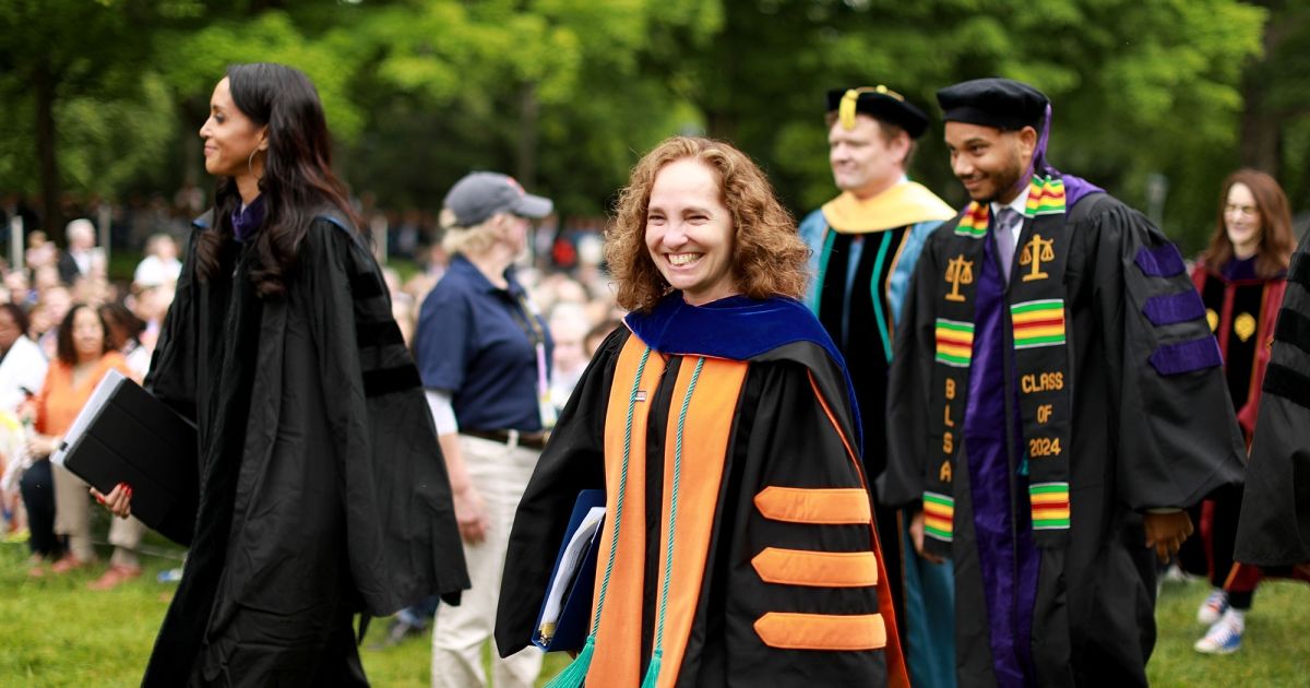 Dean Risa Goluboff, faculty, Dasha Smith and Tommy Cerja IV join the procession