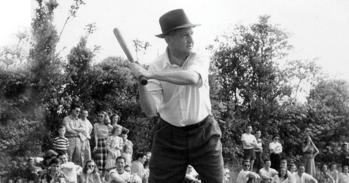 Dean F.D.G. Ribble ’21 plays softball with students and faculty in the early 1950s. 