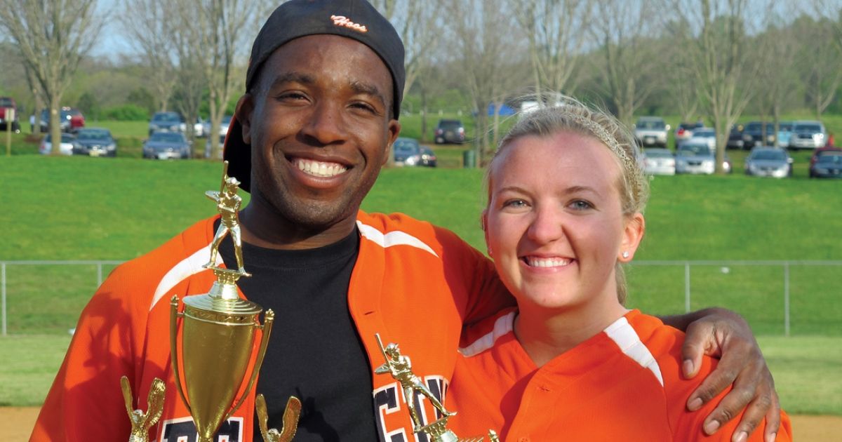 Ikenna Adams ’12 and Kristen Bromberek ’12 celebrate after their victories at the annual North Grounds Softball League invitational in 2012. 