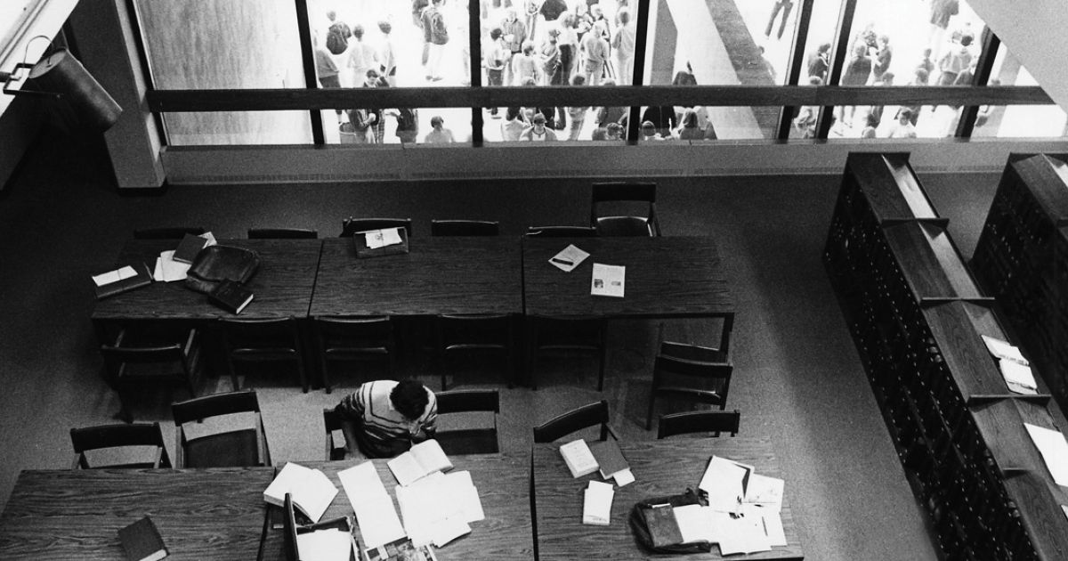 A student studies in the original library on North Grounds. 