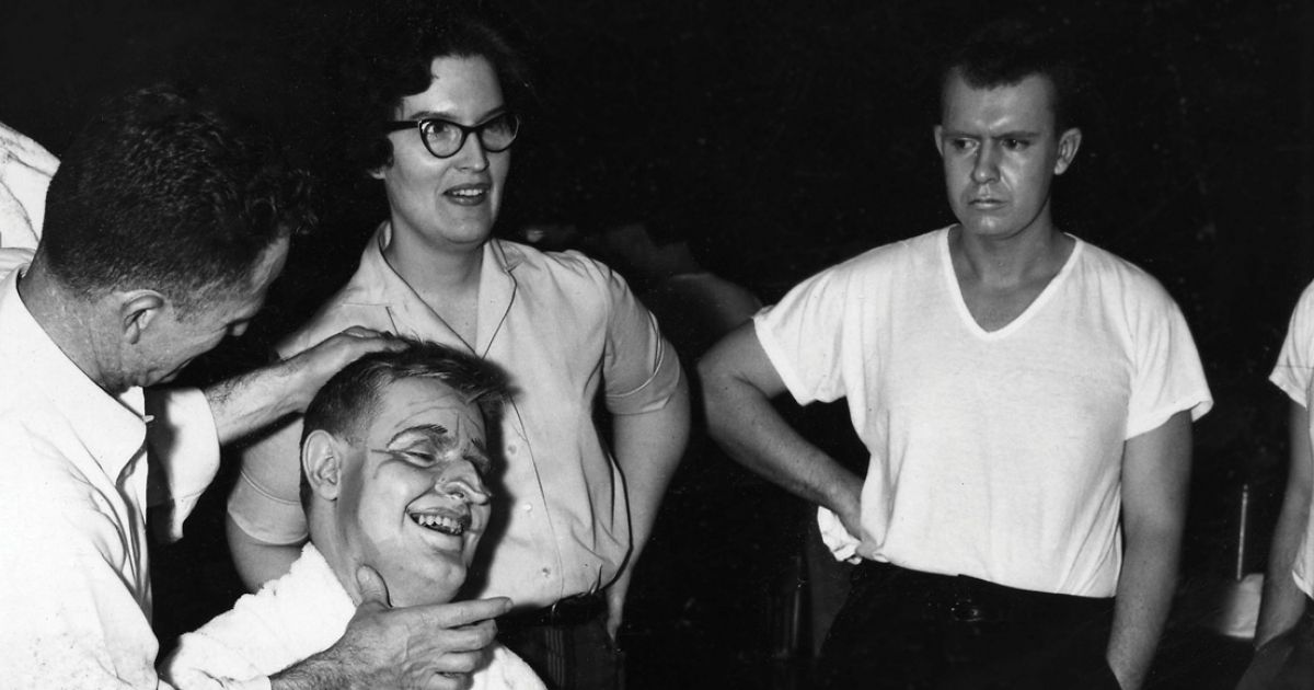 A student puts makeup on for the Libel Show in 1961. 