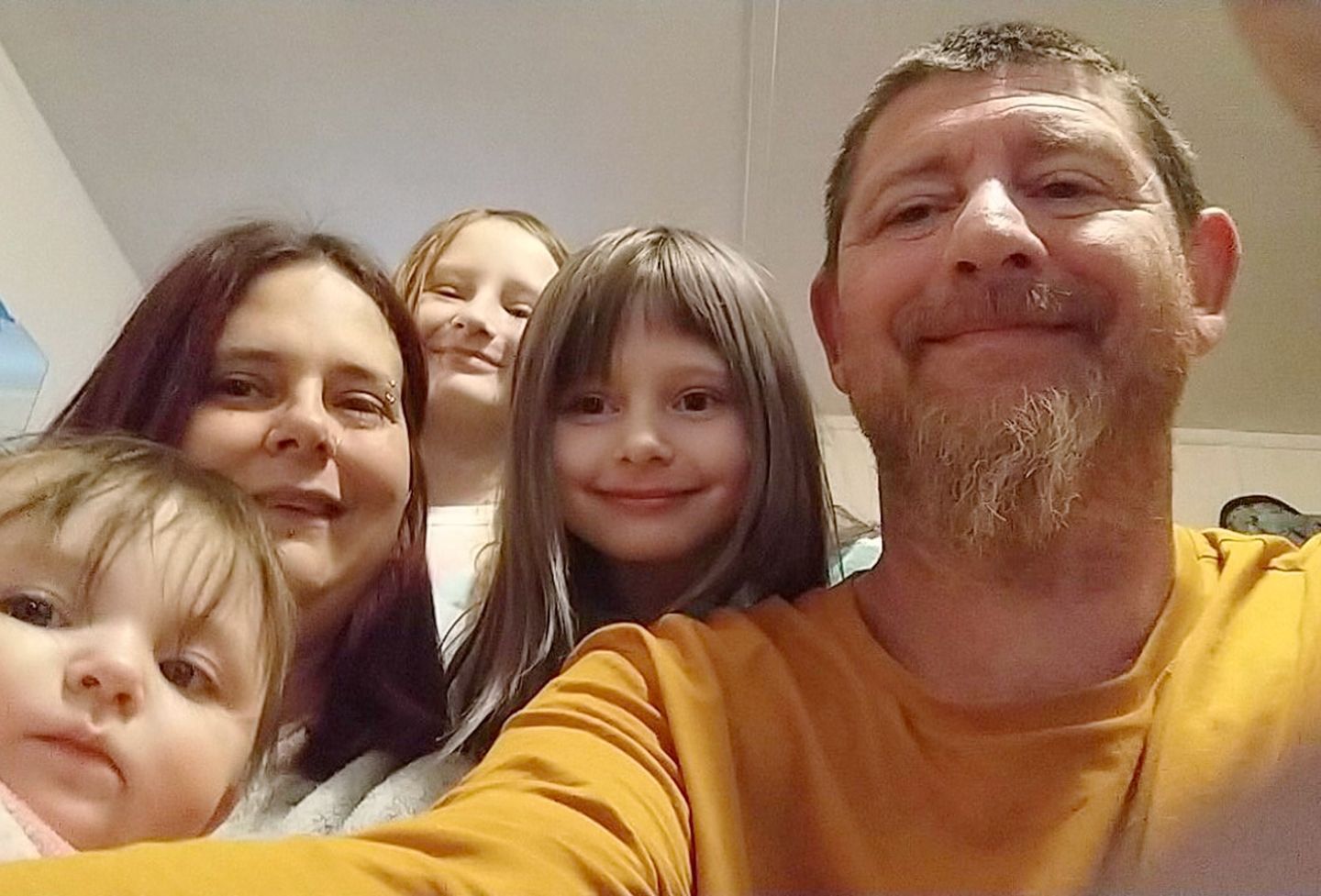 Eric Weakley pictured with his wife and three of his four daughters