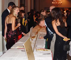 Students peruse the offerings of the silent auction.